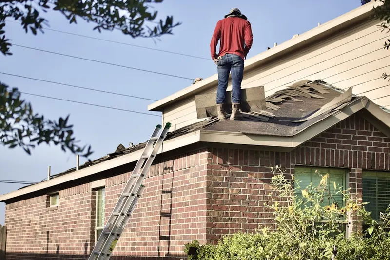 Professional roofer working on a residential roof in Solivita